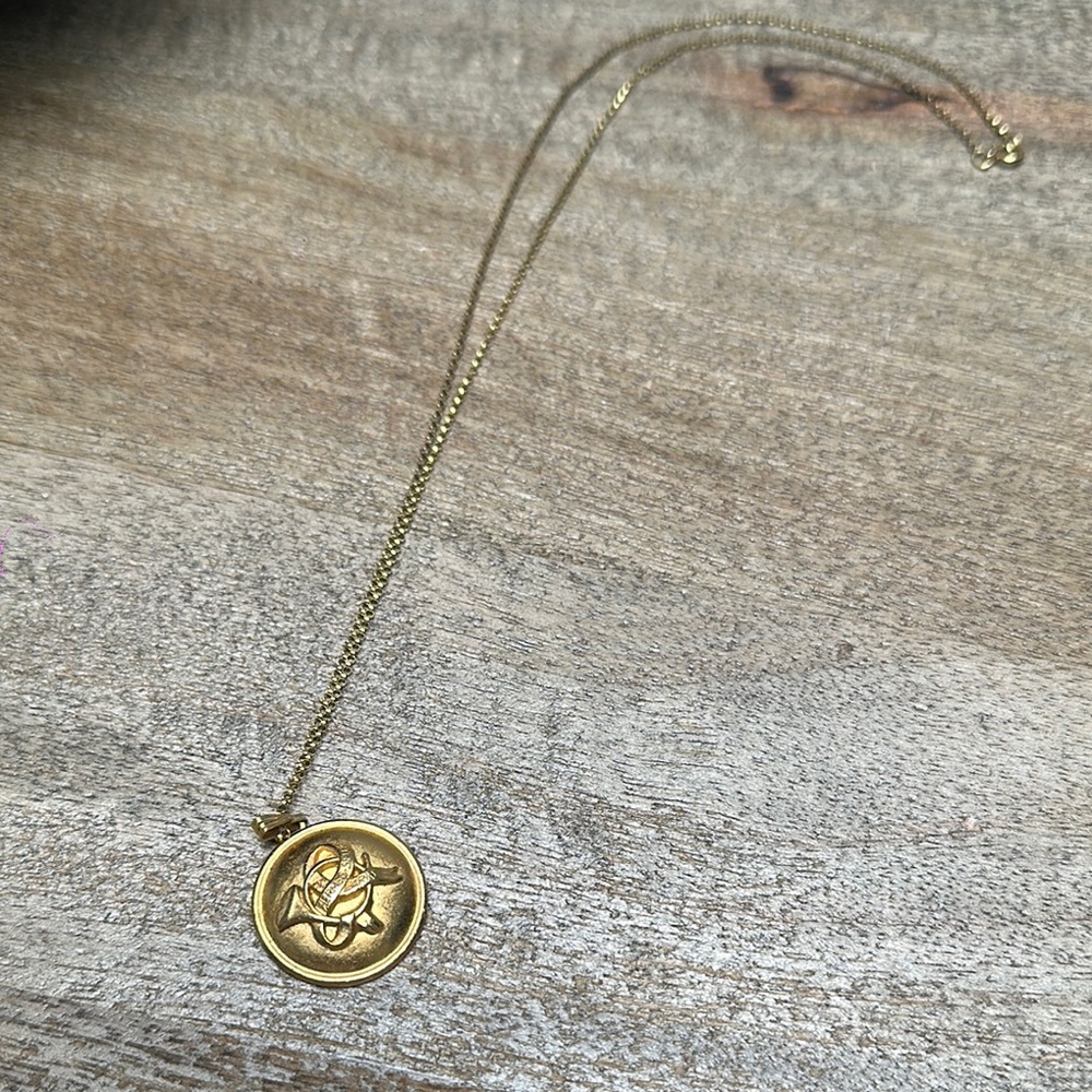 Hermes Gold Button repurposed to this gorgeous necklace